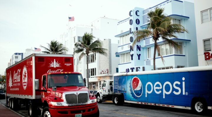 red and white ford truck on road during daytime